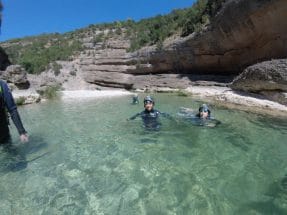 Swimming in the crystal-clear waters of Peonera Canyon