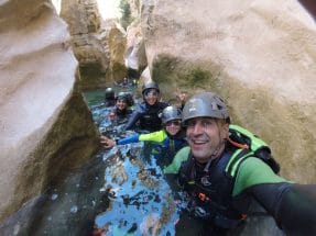 Group of canyoners enjoying the turquoise waters of Peonera Canyon